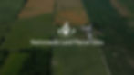 Aerial photograph of land with a green parcel outlined with a dotted white line with text overlay 'nationwide land parcel data'