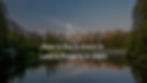 Photograph of a lake in Idaho with mountains and pine trees in the background